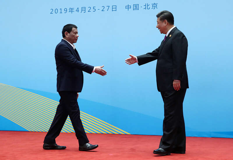 China’s President Xi Jinping welcomes Philippines President Rodrigo Duterte